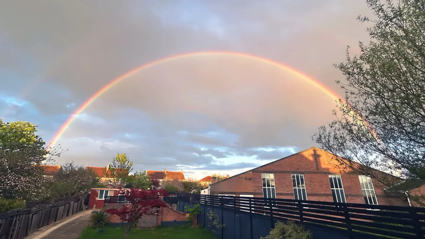 Hughenden Centre in Weston-super-Mare beneath a rainbow, the shared meeting venue of Divine Christian Church and Victorious God’s Word Ministries.